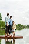 Family standing on dock, portrait