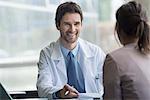 Healthcare worker meeting with patient in office