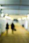 Pedestrians walking at night, defocused