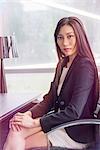 Business woman at desk, portrait