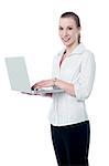 Smiling corporate woman using labtop