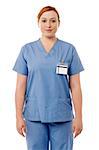 Confident female nurse on white background
