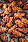 BBQ chicken wings on baking sheet
