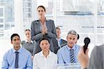 Businesswoman asking question during meeting in office