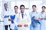 Portrait of confident doctors with arms crossed at medical office