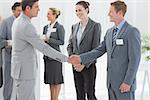 Business people shaking hands in the meeting room