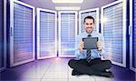 Smiling businessman showing his digital tablet against digitally generated server room with towers