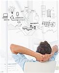 Rear view of a casual man resting with hands behind head in office against brainstorm graphic