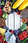 Superfood. Frame of healthy vegan ingredients on white wooden board.