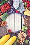 Superfood. Frame of healthy vegan ingredients on white wooden board. Toned photo.