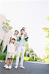 Happy Japanese family in a city park