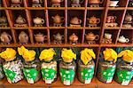 Teapots and jars of loose tea leaves in a tea shop