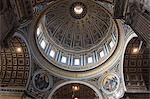 Low angle interior view of the dome of St. Peter's Basilica in Vatican City, Rome.