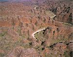 Piccaninny Creek winding through Piccaninny Gorge in the central Bungle Bungle Range. The creek can flood in the wet season, December to April, and some stagnant water remains year-round. Purnululu National Park, Kimberley region, Western Australia.