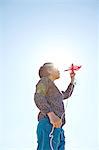 Young boy flying kite