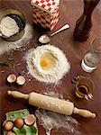 Overhead view of baking preparation with flour and eggs