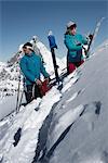 Couple with skis on mountain, Zermatt, Valais, Switzerland