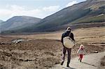 Father and son out hiking, Fairy Pools, Isle of Skye, Hebrides, Scotland