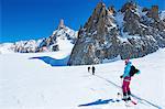 Three skiers on Mont Blanc massif, Graian Alps, France