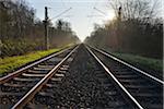 Railroad tracks with Sun, Arheilgen, Darmstadt, Hesse, Germany