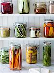 Preserved fruit and vegetables on shelves in a pantry