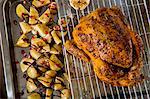 Roast chicken with balsamic potatoes and pomegranate seeds