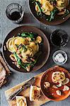 Ravioli with spinach, mushrooms and Marsala served with garlic crostini (seen from above)