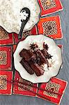 Braised ribs with anise, soya sauce and honey with a side of rice (Asia)