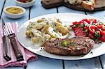 Pork neck steam with potato salad and tomato salad