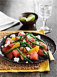 Watermelon salad with citrus fruits, green beans and feta cheese