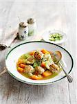 Vegetable soup with chicken and herb dumplings