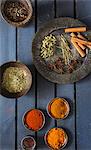 Various spices in bowls and on a plate