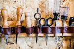 Row of hand tools on workshop wall