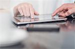 Hand of business person using digital tablet