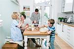 Family in kitchen having breakfast