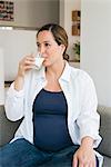 Pregnant woman drinking milk