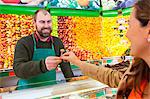 Female customer shopping in greengrocer's shop