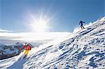 Ski holiday, Two skiers carving downhill, Sudelfeld, Bavaria, Germany