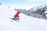 Ski holiday, Woman skiing downhill, Sudelfeld, Bavaria, Germany