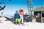 Ski holiday, Mother and son at ski lift, Sudelfeld, Bavaria, Germany