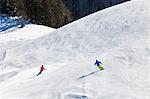 Ski holiday, Skiers carving downhill, Sudelfeld, Bavaria, Germany