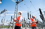 Engineers checking electricity substation