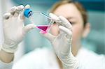 Scientist examining liquid in laboratory