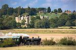 Steam train of the Kent and East Sussex Railway and Bodiam Castle, a National Trust tourist attraction, East Sussex, England, United Kingdom, Europe