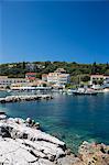 Spectacular beach resort and harbour of Kassiopi with blue sky and turquoise Ionian Sea, Corfu, Ionian Islands, Greek Islands, Greece, Europe