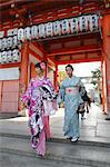 Young Japanese girls in traditional kimonos, Yasaka Shrine, Kyoto, Japan, Asia