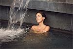 Woman soaking in spa pool