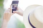 Woman taking selfie with smartphone