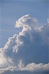 Fluffy cumulus clouds against blue sky