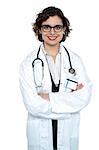 Portrait of a confident female medical professional isolated over white.
